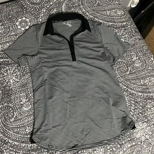 Under Armour golf polo. Moisture wicking material.